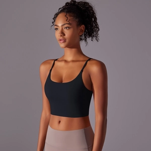 Detail of black minimalist yoga bra featuring thin straps and supportive stretch fabric