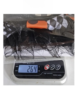 Detail shot of a Halloween wreath weighing 264g on an electronic weighing scale