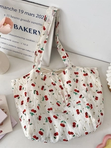 Floral cherry print canvas tote bag with drawstring closure and wrinkled texture
