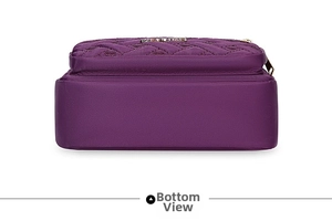 Detailed bottom view of purple quilted oxford crossbody bag showing wide capacity base