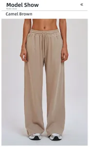 Detailed view of camel brown wide-leg sweatpants with adjustable drawstring waistband