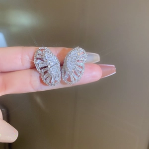 Detailed view of silver zircon butterfly earrings with sparkling cubic zirconia crystals