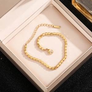 Elegant gold stainless steel cube chain bracelet with lobster clasp in a jewelry box