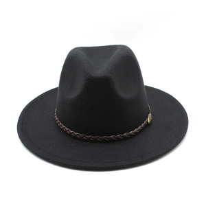 Close-up of black felt fedora hat featuring a brown braided leather band and copper badge