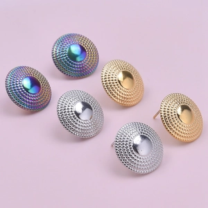 Close-up of 304 stainless steel round earrings with colorful, gold, and silver finishes