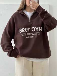 Chocolate brown half-zip sweatshirt with NYC 1998 print and relaxed fit for women