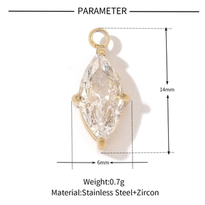 Macro shot of gold stainless steel marquise pendant with zircon showing size and weight