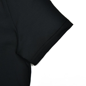 Close-up of black short sleeve cuff with high-quality double-needle stitching texture