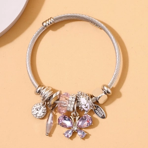 Silver twisted bangle with purple crystal butterfly, zircon charms and handmade tag