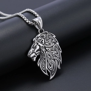 Vintage silver lion head pendant with intricate Celtic knot patterns on a round box chain
