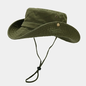 Detail of army green canvas bucket hat with adjustable chin strap and metal ventilation eyelets