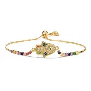 Detailed close-up of 18K gold-plated Hamsa Hand bracelet with colorful cubic zirconia