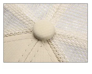 Detailed close-up of mesh fabric and reinforced stitching on a breathable baseball cap