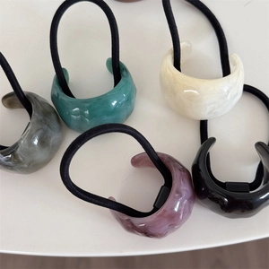 Five assorted retro acrylic hair ties with C-shaped marble patterns for women