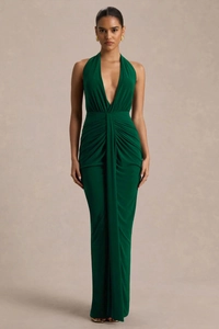 Detail view of the elegant ruching and slim-fit waist on this dark green V-neck gown
