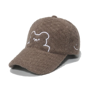 Brown fleece baseball cap with cute bear and smiley face embroidery on white background