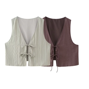 Detail of V-neck tie-front crop tops featuring pleated texture in sage green and mocha brown