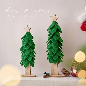 Green felt Christmas tree tabletop decorations with wooden base and star topper