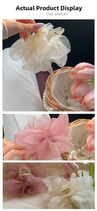 Detail view of large multi-layer organza bow hair claw clips in soft pastel colors