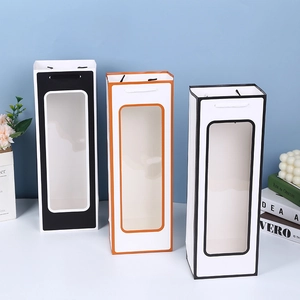Three elegant wine gift bags with transparent windows in black, orange, and white paper