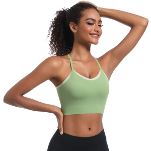 Front view of light green sports bra with cream trim for yoga and fitness training
