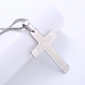 Polished stainless steel cross pendant necklace with engraved Spanish Lord's Prayer text