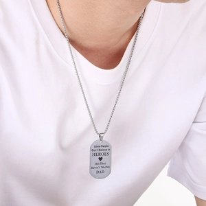 Macro detail of Dad military tag necklace with engraved sentimental message for Father's Day