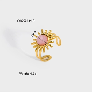Detailed view of sun flower gold open ring with 8mm pink gemstone and hollow band
