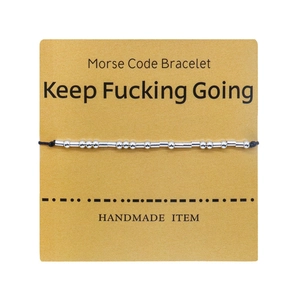Morse code handmade bracelet with silver beads on card featuring Keep Fucking Going slogan