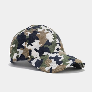 Detail of forest camouflage baseball cap showing cotton corduroy texture and curved brim