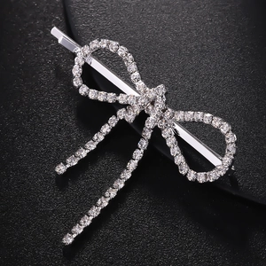 Elegant silver bow hair clip with sparkling rhinestones and tassels for women's hair styling