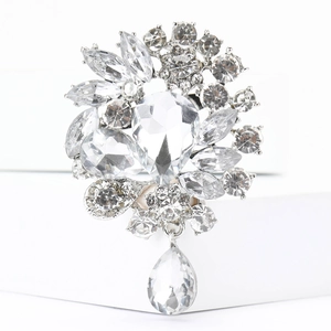 Detail of luxury teardrop crystal brooch with marquise stones and silver metal base