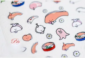 Macro detail of cartoon food-themed stickers with salmon and egg designs on art paper