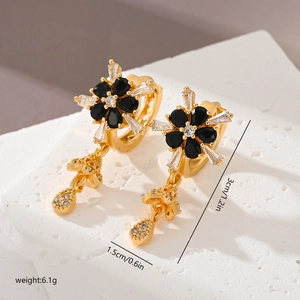 Flower shaped copper earrings with black cubic zirconia and teardrop pendant details