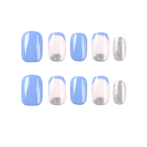 Short square press-on nails in blue and silver glitter with a classic French tip design