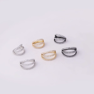 Close-up of triple-row zircon seamless hoops in silver, gold, and black finishes