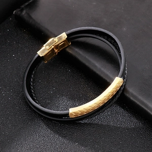 Macro detail of men's leather bracelet with gold stainless steel magnetic clasp