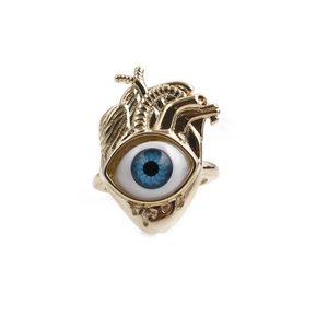 Gold-plated anatomical heart ring with blue evil eye zircon on a white background