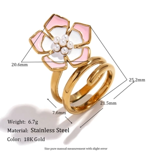 Close-up of a three-layer flower ring with pink and white enamel petals and pearl center