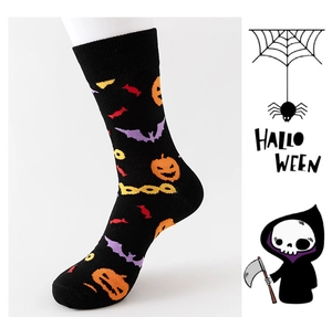 Detail of Halloween socks with orange pumpkins and purple bats on black knit fabric