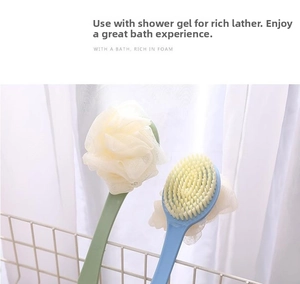 Close-up of long handle bath brush set with soft bristles and mesh sponge in a basket