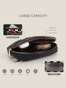 Detail showing internal card slots, ID window, and large capacity of this black wristlet