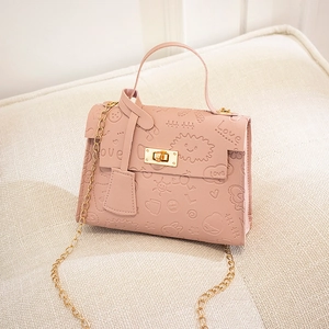 Detailed view of pink PU leather bag with cartoon sun, clouds, and Love embossing