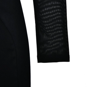 Detailed close-up showing the breathable mesh fabric texture on the black long sleeve dress
