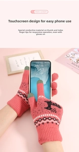 Close-up of pink knit gloves with touchscreen-friendly thumb and index finger tips
