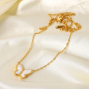 Exquisite 14K gold butterfly necklace with white mother of pearl inlay on silk fabric