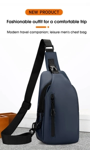 Detail of navy blue waterproof chest bag with adjustable strap and dual zipper compartments
