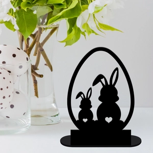 Close-up of black acrylic Easter bunny silhouette in an egg frame for table decor