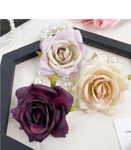 Detailed macro view of artificial rose hair ties in purple and cream gradient shades