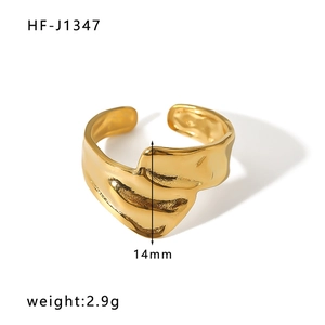 Detail shot of irregular gold wave open ring with 14mm width and liquid metal texture